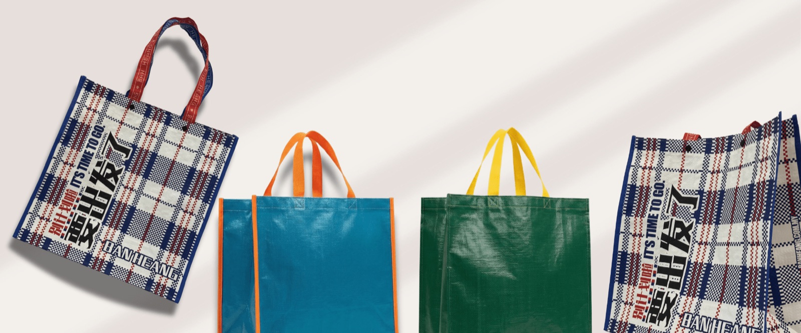 PP woven bags with a glossy finish, in plaid, teal and green, with contrasting handles